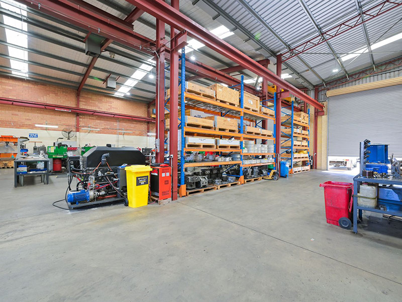 Inside image of clean factory with shelving